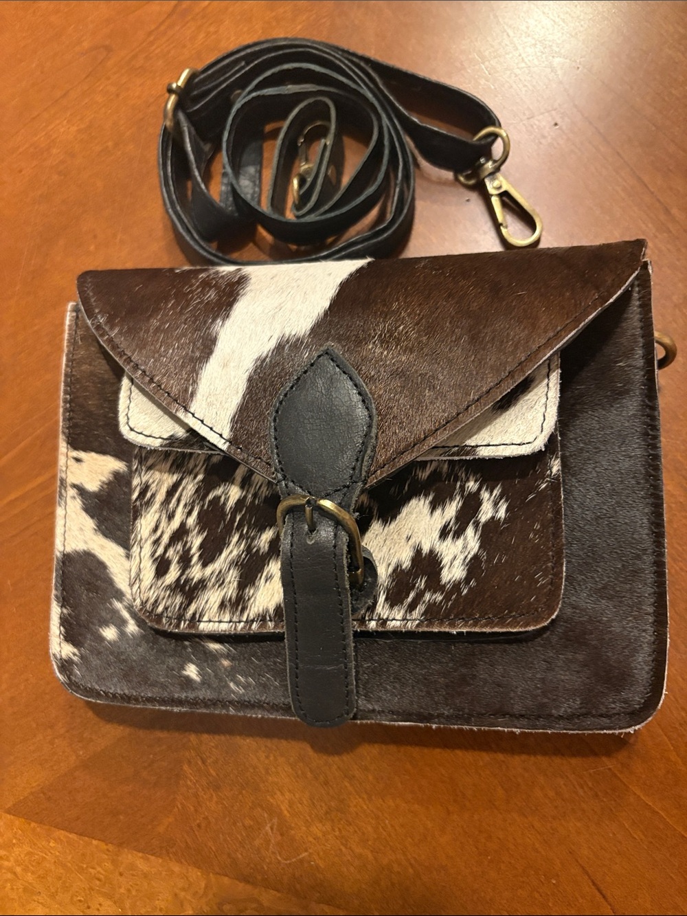 Buckle Brown and White Cowhide Crossbody with Black Leather Strap
